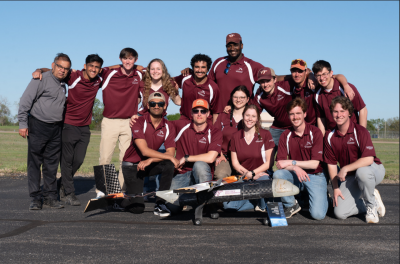 The 2024 Virginia Tech Design, Build, Fly team with their aircraft, The Hokie Express, at the annual AIAA competition. 
